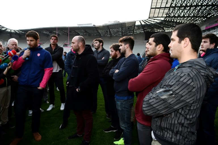 Stade Francais players, pictured here speaking to journalists in Paris on March 13, 2017, voted overwhelmingly to strike and refused to train or play this season after a shock merger was announced between their side and rivals Racing 92