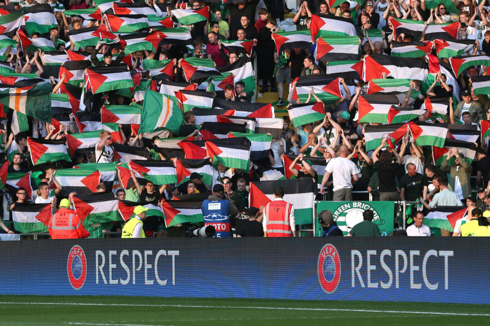 Celtic fans hold up Palestine flags Action Images via Reuters / Russell Cheyne Livepic EDITORIAL USE ONLY. - RTX2LL97