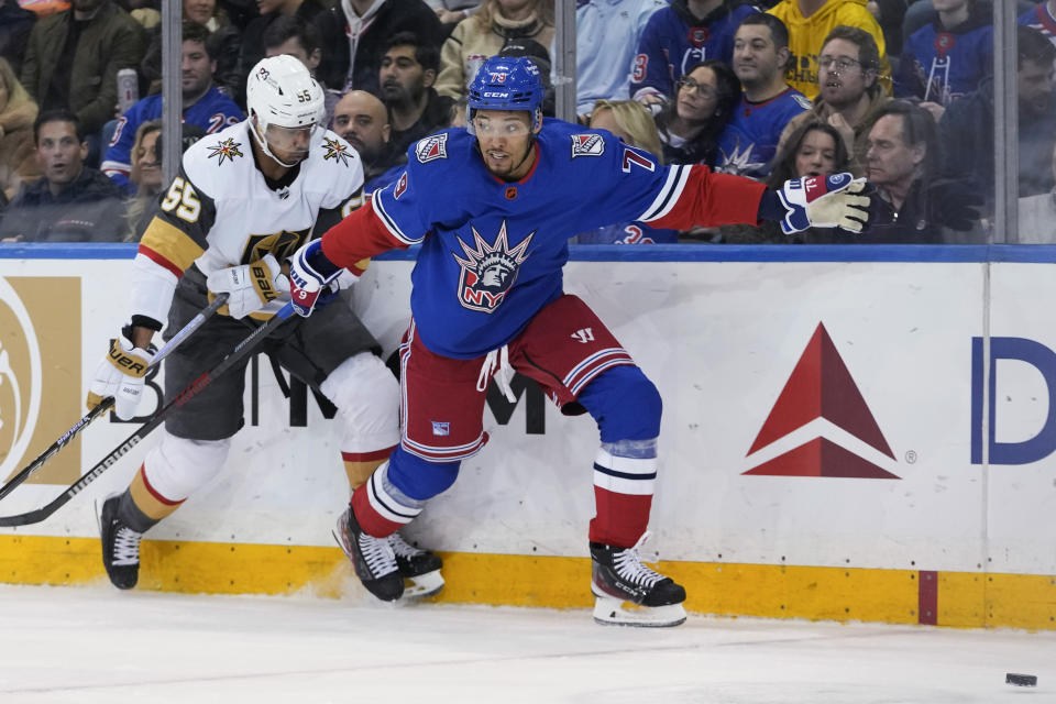 New York Rangers defenseman K'Andre Miller (79) skates against Vegas Golden Knights right wing Keegan Kolesar (55) during the second period of an NHL hockey game Friday, Jan. 27, 2023, at Madison Square Garden in New York. (AP Photo/Mary Altaffer)