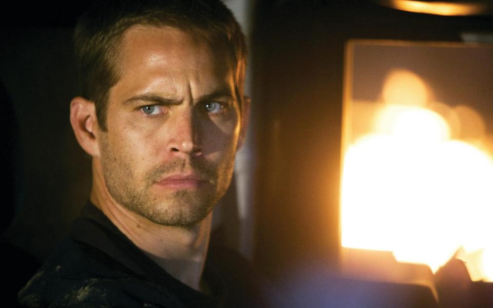 The late Paul Walker as agent Brian O'Conner in the ultimate chapter of the franchise built on speed 'Fast and Furious" - Jaimie Trueblood/ Film Stills