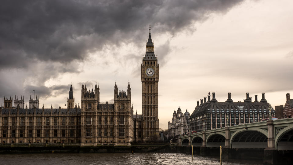  Houses of Parliament in London with bank of grey clouds above. 