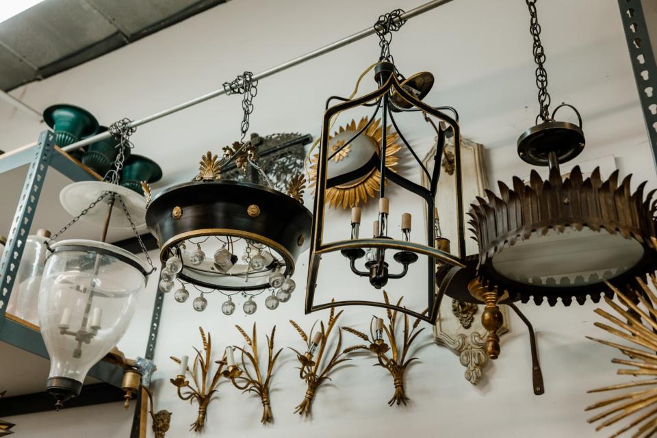 Antique fixtures hanging in Rosselli's workshop.