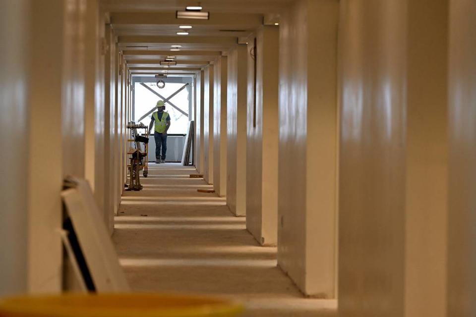 The transformation from gateway to destination point is getting closer as the Marriott Palmetto Resort and Spa nears completion and the expansion and renovation of the Bradenton Area Convention Center begins. A worker at the end of the hallway on the 8th floor of the resort.