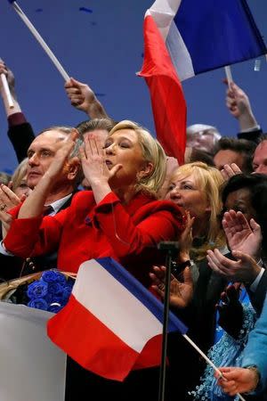 Marine Le Pen, French National Front (FN) political party leader and candidate for French 2017 presidential election, waves to supporters at the end of a political rally in Lille, France, March 26, 2017. REUTERS/Pascal Rossignol