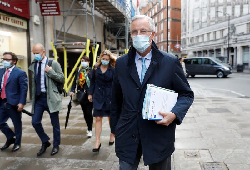 EU chief negotiator Michel Barnier wearing a protective mask leaves his hotel in London