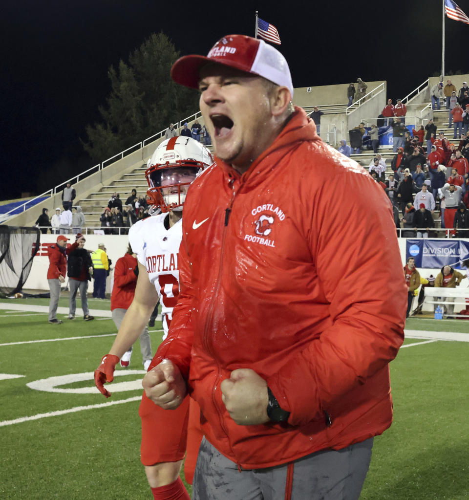 Cortland coach Curt Fitzpatrick celebrates the team's win over North Central in the Amos Alonzo Stagg Bowl NCAA Division III championship football game in Salem, Va., Friday Dec. 15, 2023. (Matt Gentry/The Roanoke Times via AP)