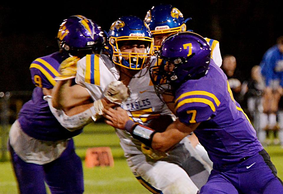 Watertown's Austin Johnson and Marcus Rabine (8) bring down Aberdeen Central's Austin Erickson during their Eastern South Dakota Conference football game on Friday, Sept. 30, 2022. The fifth-rated Class 11AA Golden Eagles are set to host No. 4 Brookings and Watertown visits Mitchell in Eastern South Dakota Conference games on Friday.