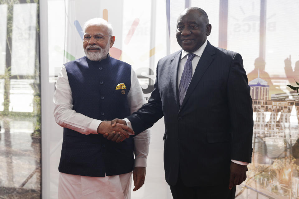 India's Prime Minister Narendra Modi, left, shakes hands with South African President Cyril Ramaphosa at the 2023 BRICS Summit in Johannesburg, South Africa, Wednesday, Aug. 23, 2023. (Gianluigi Guercia/Pool via AP)