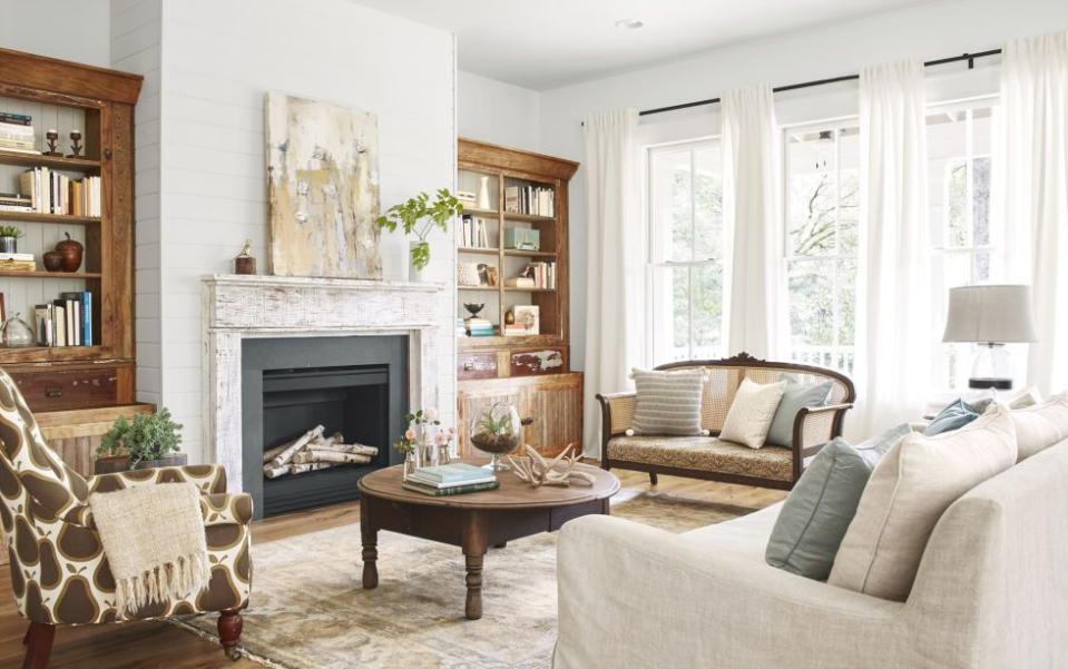 a living room with a couch and fireplace