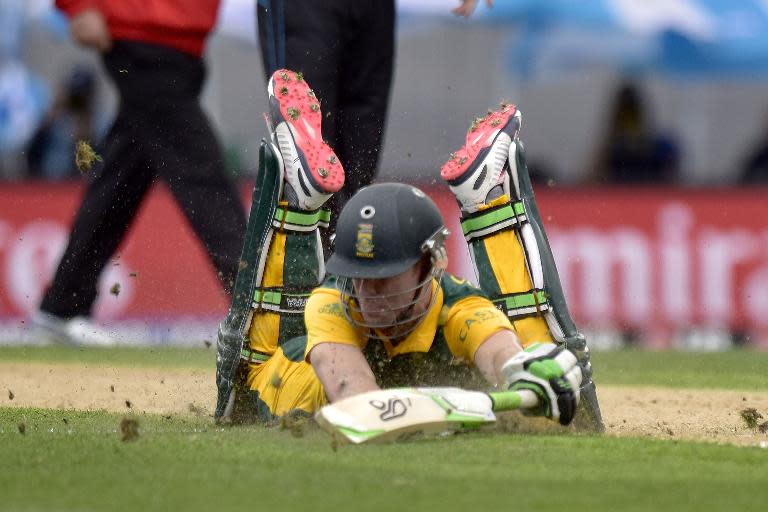 South African captain AB de Villiers dives to make his ground during the World Cup semi-final against New Zealand at Eden Park in Auckland on March 24, 2015