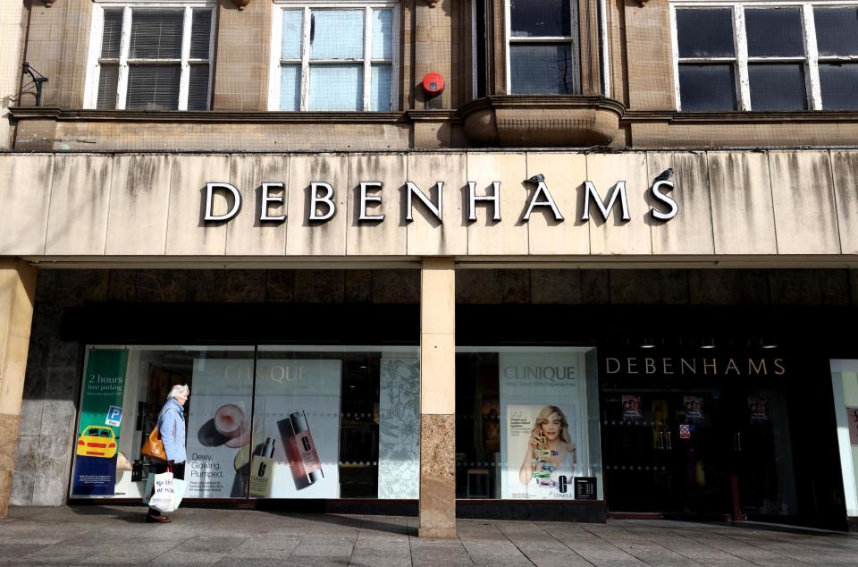 File photo dated 23/3/2020 of a person walking past a Debenhams store in Nottingham. The department store chain is expected to slide into administration in the coming days following the impact of coronavirus (PA Images): (PA Images)