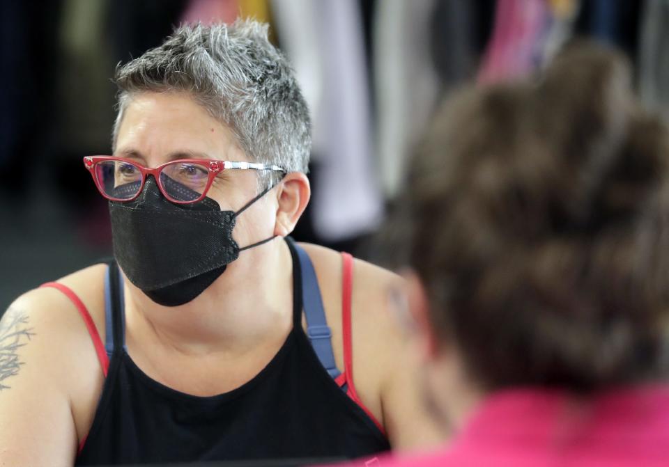 Kathy Flores listens during a Diverse + Resilient staff meeting June 9, 2022, in Appleton.