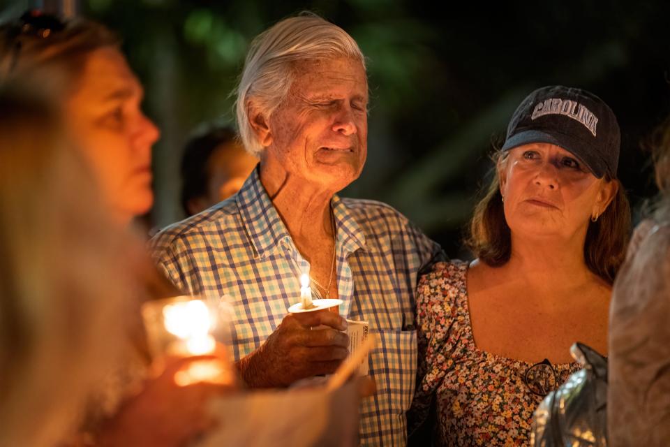 Phillip Causey cries next to his daughter Penny Causey at a 2022 vigil in Palm Beach Gardens as they remember Phillip Causey Jr., 38, who lost his battle with addiction in 2020.