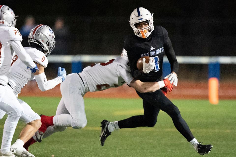 Nolensville wide receiver Chance Fitzgerald (1) tries to get past Page's Brendan Anes (22) during the first half of a TSSAA Class 5A State quarterfinal game at Nolensville High School  Friday, Nov. 18, 2022 in Nolensville, Tenn. 