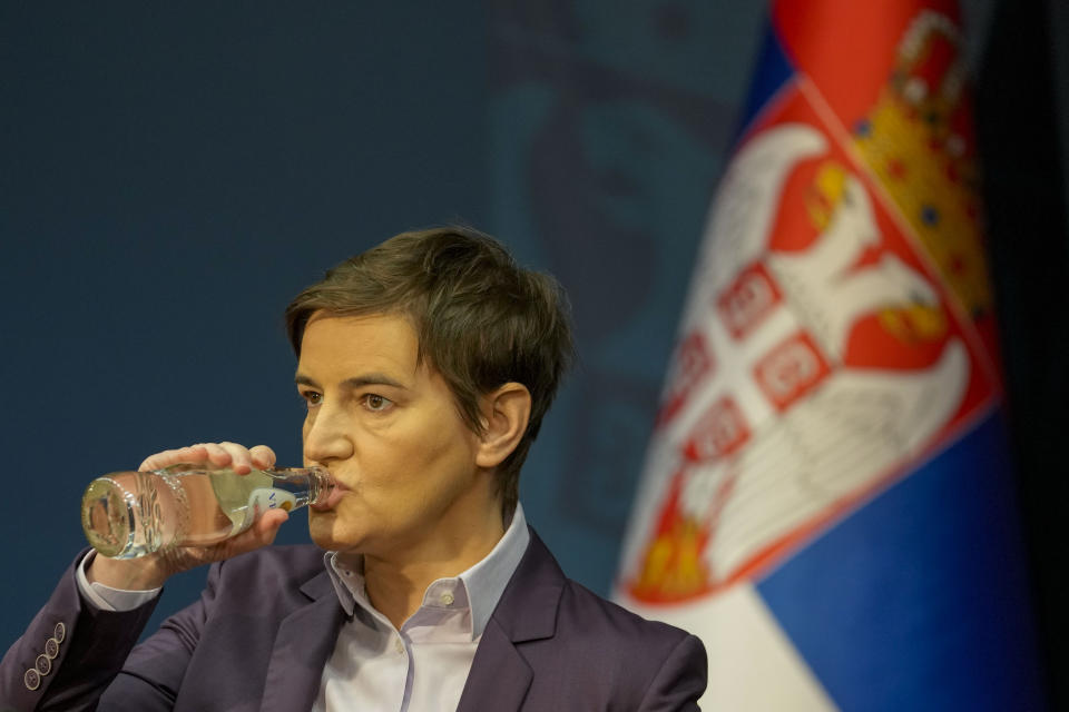 Serbian outgoing Prime Minister Ana Brnabic drinks water during a press conference in Belgrade, Serbia, Wednesday, Feb. 28, 2024. The final international report about a tense early vote last December in Serbia concluded on Wednesday that the election was held in unjust conditions and "marred by harsh rhetoric, bias in the media, pressure on public sector employees and misuse of public resources." Outgoing Prime Minister Ana Brnabic on Wednesday accused opposition groups and independent media of creating a "false narrative" about the alleged election fraud with an aim to destabilize the country. (AP Photo/Darko Vojinovic)