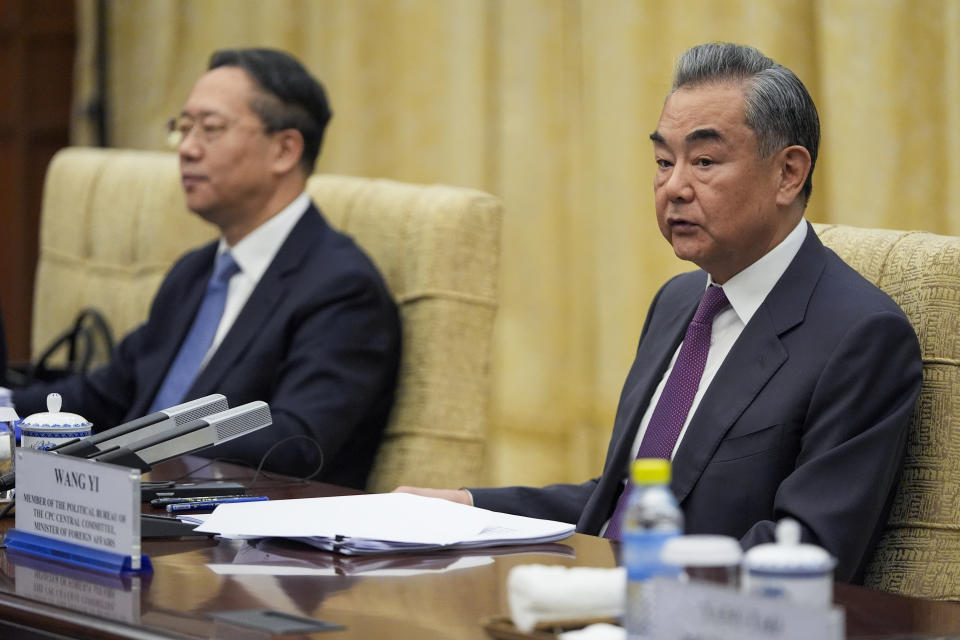 China's Foreign Minister Wang Yi, right, reacts during a meeting with U.S. Secretary of State Antony Blinken at the Diaoyutai State Guesthouse, Friday, April 26, 2024, in Beijing, China. (AP Photo/Mark Schiefelbein, Pool)