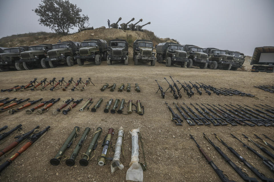 Weapons and equipment surrendered by Armenian forces in Nagorno-Karabakh are displayed in Signag village, Azerbaijan, Sunday, Oct. 1, 2023. Armenian forces in Nagorno-Karabakh laid down their weapons after a lightning military operation in which Azerbaijan reclaimed control of the breakaway region after three decades of separatist rule. (AP Photo/Aziz Karimov)