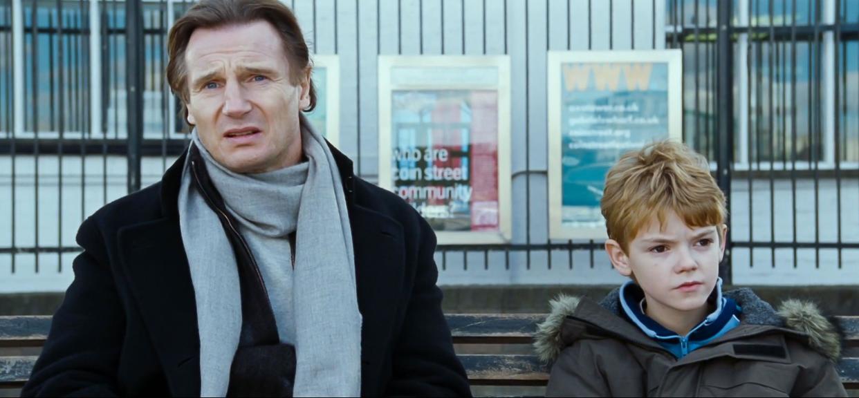 UK. Liam Neeson and Thomas Brodie-Sangster in a scene from the ©Universal Pictures movie : Love Actually (2003).  Plot: Follows the lives of eight very different couples in dealing with their love lives in various loosely interrelated tales all set during a frantic month before Christmas in London, England.  Ref:  LMK110-J6851-121020 Supplied by LMKMEDIA. Editorial Only. Landmark Media is not the copyright owner of these Film or TV stills but provides a service only for recognised Media outlets. pictures@lmkmedia.com