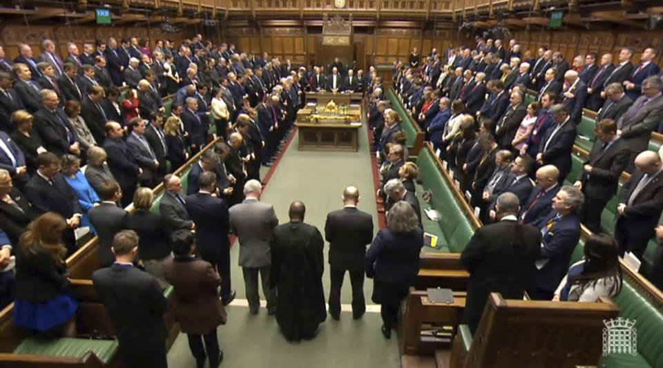 In this image taken from video, members of Britain's House of Parliament observe a minute of silence paying respect to the victims of yesterday's attack in London, Thursday March 23, 2017. On Wednesday a man went on a deadly rampage, first driving a car into pedestrians then stabbing a police officer to death before being fatally shot by police within Parliament's grounds in London.(PA via AP)