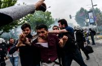 Turkish anti-riot police detain a protester during clashes at a May Day rally in Bakirkoy, a district of Istanbul, on May 1, 2016