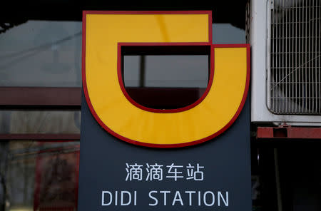 FILE PHOTO: The logo of Didi Chuxing is seen at a Didi station in Beijing, China January 2, 2019. REUTERS/Jason Lee/File Photo