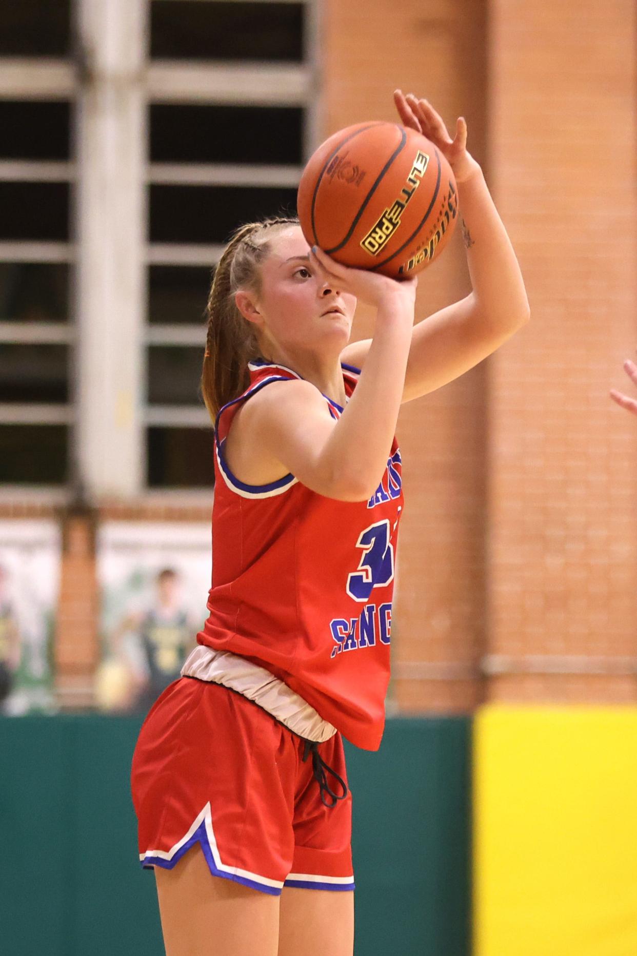 Claude’s Bobbie Renee Fouquet (33) shoots a three pointer in a 1A bi-district playoff game against Fort Elliott, Monday night, February 13, 2023, at McNeely Fieldhouse at Pampa High School, Pampa, Texas. Claude won 69-18.