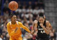 Tennessee's Jazmine Massengill, left, and Connecticut's Aubrey Griffin chase a loose ball in the first half of an NCAA college basketball game, Thursday, Jan. 23, 2020, in Hartford, Conn. (AP Photo/Jessica Hill)