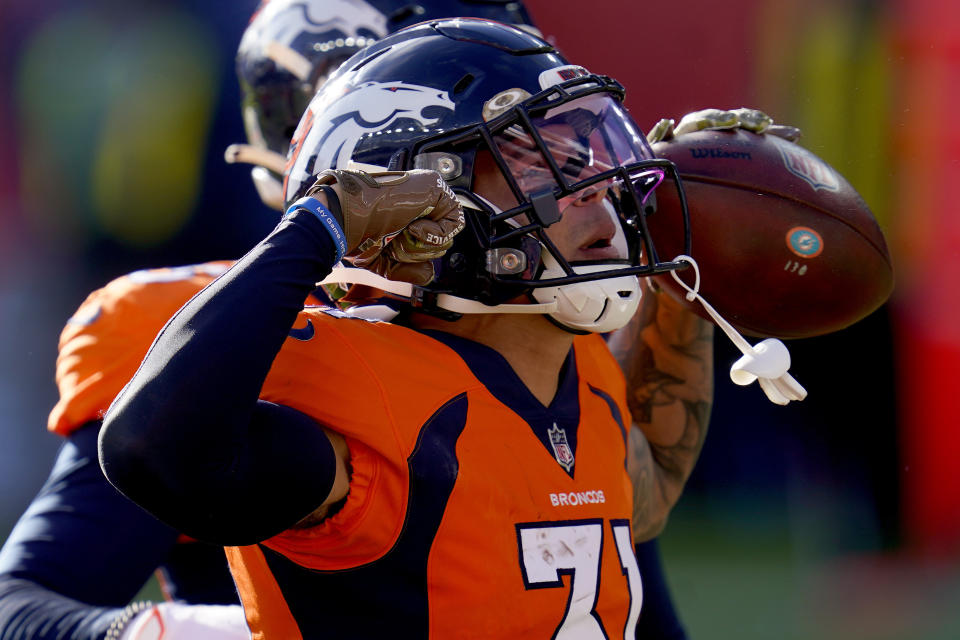 Denver Broncos free safety Justin Simmons (31) celebrates his interception against the Miami Dolphins during the first half of an NFL football game, Sunday, Nov. 22, 2020, in Denver. (AP Photo/David Zalubowski)