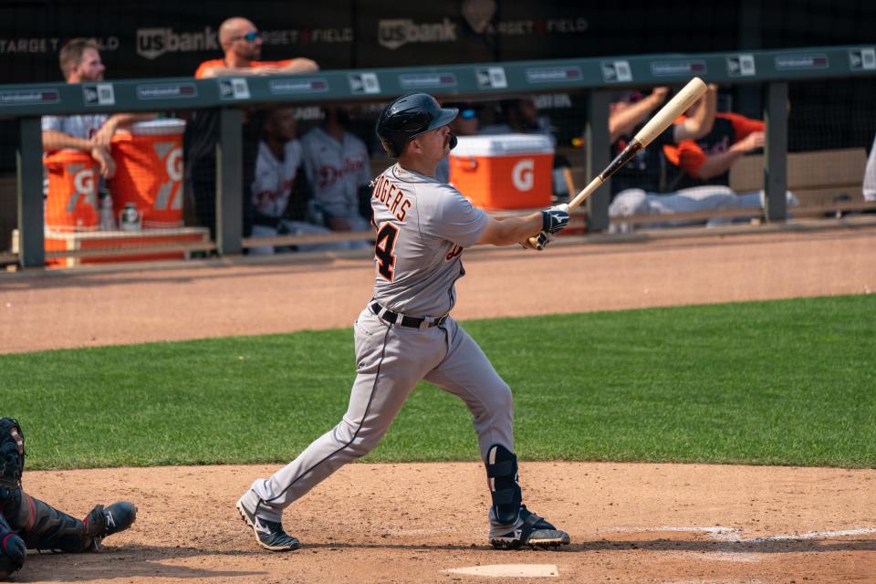 Tigers catcher Jake Rogers hits a grand slam during the ninth inning of the 12-9 loss to the Twins in 10 innings on Sunday, July 11, 2021, in Minneapolis.
