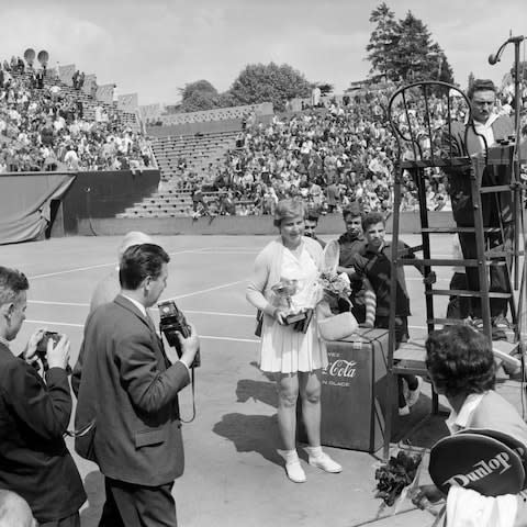 Christine Truman with the winner's trophy at Roland Garros in 1959 - Credit: afp