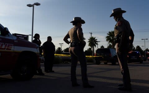  A local student was killed in the attacks, while three local police officers were shot - Credit: Reuters