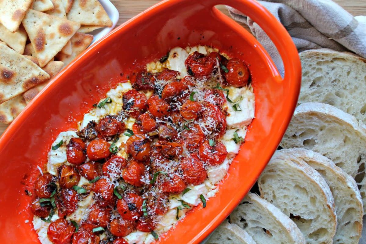 <p>Foody Schmoody Blog</p><p>The baked feta trend started as a pasta dish but has morphed into so many different things like this dip which uses goat cheese over the feta.</p><p><strong>Get the recipe: <a href="https://foodyschmoodyblog.com/baked-tomato-goat-cheese-dip/" rel="nofollow noopener" target="_blank" data-ylk="slk:Tomato Goat Cheese Dip;elm:context_link;itc:0;sec:content-canvas" class="link rapid-noclick-resp">Tomato Goat Cheese Dip</a></strong></p>