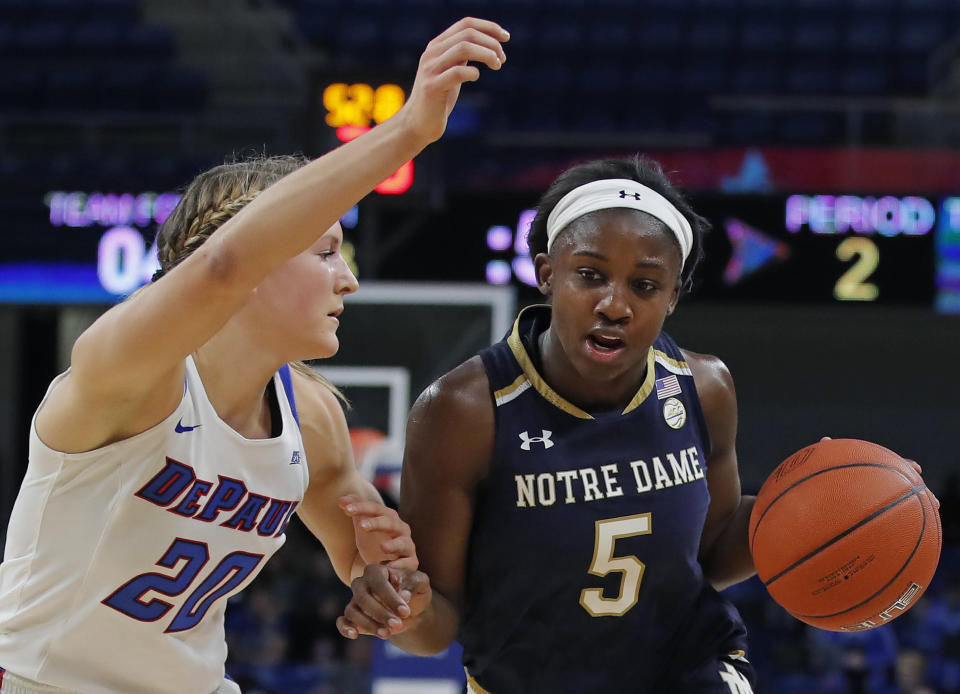 Notre Dame's Jackie Young, right, is guarded by DePaul's Kelly Campbell during the first half of an NCAA college basketball game Saturday, Nov. 17, 2018, in Chicago. (AP Photo/Jim Young)