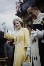 <p>Lord Mayor Emmet McDermott of Sydney accompanied the queen, who was dressed in a yellow coat with white accents, for a walkabout near the Town Hall in Sydney.<br></p>