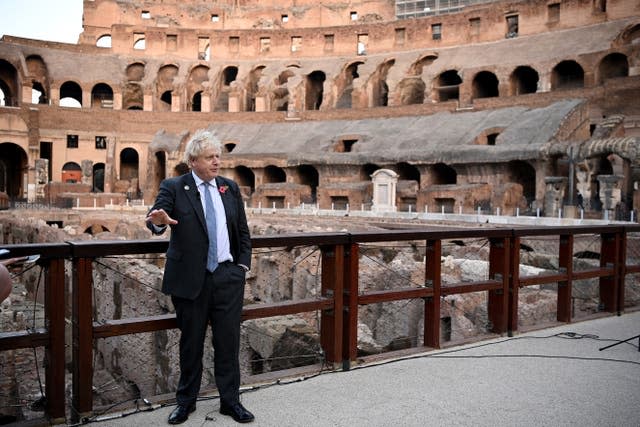 Prime Minister Boris Johnson visits the Colosseum during the G20 summit in Rome, Italy