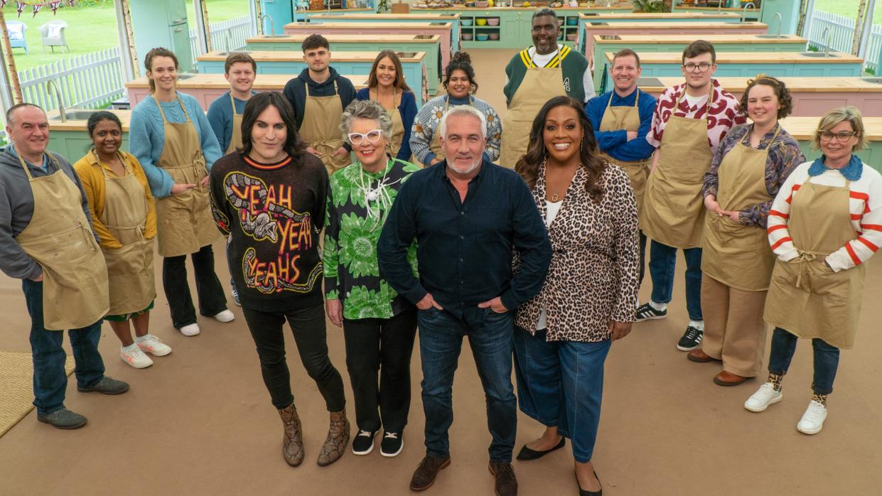  The Great British Bake Off 2023 contestants standing in a tent with the judges and presenters  . 