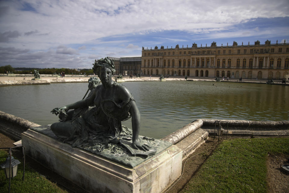 The statue « Nymphe et enfant au trident » by Philippe Magnier is seen in the gardens of the Chateau de Versailles, outside Paris, France, Tuesday, Sept.19, 2023. The park of the Chateau de Versailles will host the equestrian events at the Paris 2024 Olympic Games. (AP Photo/Christophe Ena, File)