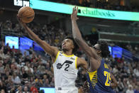 Utah Jazz guard Collin Sexton (2) goes to the basket as Indiana Pacers forward Jalen Smith (25) defends during the second half of an NBA basketball game Friday, Dec. 2, 2022, in Salt Lake City. (AP Photo/Rick Bowmer)