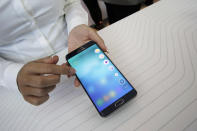 <p>FILE – In this Aug. 13, 2015, file photo, a product expert demonstrates the Samsung Galaxy S6 Edge Plus during a presentation at Lincoln Center in New York. Apple’s new iPhone X has special features and its price tag is appropriately special: $999. But a solid new phone doesn’t have to cost that much. Going with an older phone can mean significant savings, but it won’t come with the latest camera and screen technology of the newest phones. (AP Photo/Mary Altaffer, File) </p>
