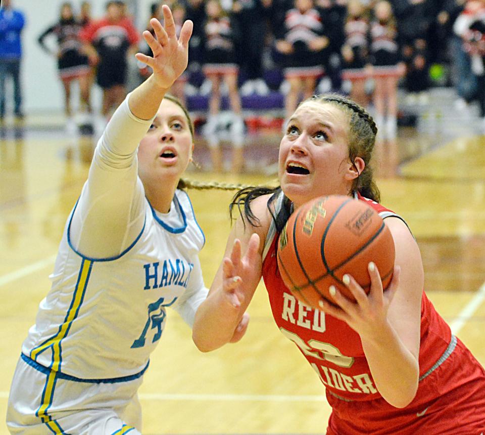 Wagner's Emma Yost eyes the basket against Hamlin's Ally Abraham during the championship game of the state Class A girls basketball tournament on Saturday, March 11, 2023 in the Watertown Civic Arena.