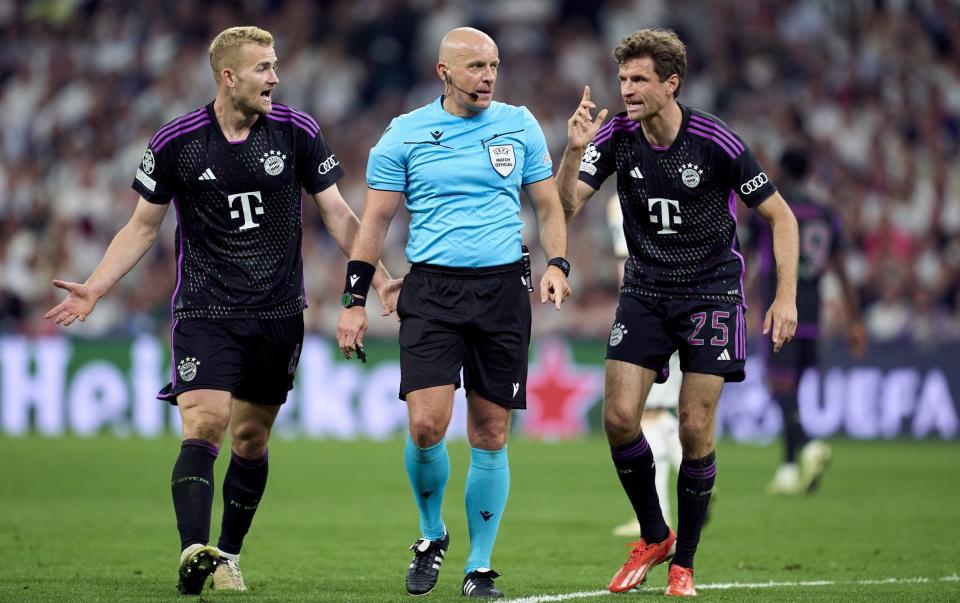 De Ligt, left, and Muller were furious with referee Szymon Marciniak
