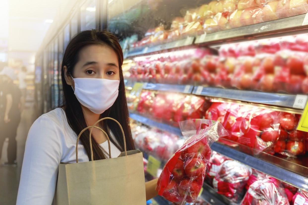 The pandemic-era expansion of SNAP benefits ended in all U.S. states by March 2023. <a href="https://www.gettyimages.com/detail/photo/asian-woman-wearing-protective-face-mask-hold-paper-royalty-free-image/1253665535?adppopup=true" rel="nofollow noopener" target="_blank" data-ylk="slk:aogreatkim/iStock/Getty Images Plus via Getty Images;elm:context_link;itc:0;sec:content-canvas" class="link ">aogreatkim/iStock/Getty Images Plus via Getty Images</a>