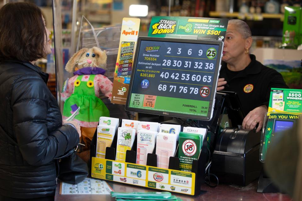 A lottery ticket is sold from the register where the winning $1.13 billion Mega Millions ticket was purhcased at a ShopRite Liquor store in Neptune Township, N.J.