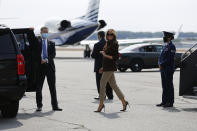 First lady Melania Trump smiles as she arrives at Manchester Regional Airport, Thursday, Sept. 17, 2020, in Manchester, N.H. (AP Photo/Mary Schwalm)