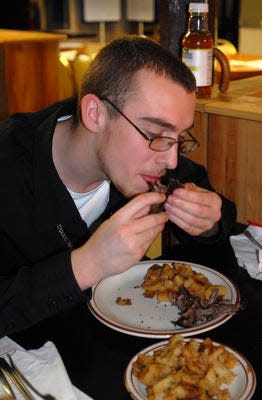 A 2009 photo of a Wagon Wheel diner enjoying a muskrat dinner.