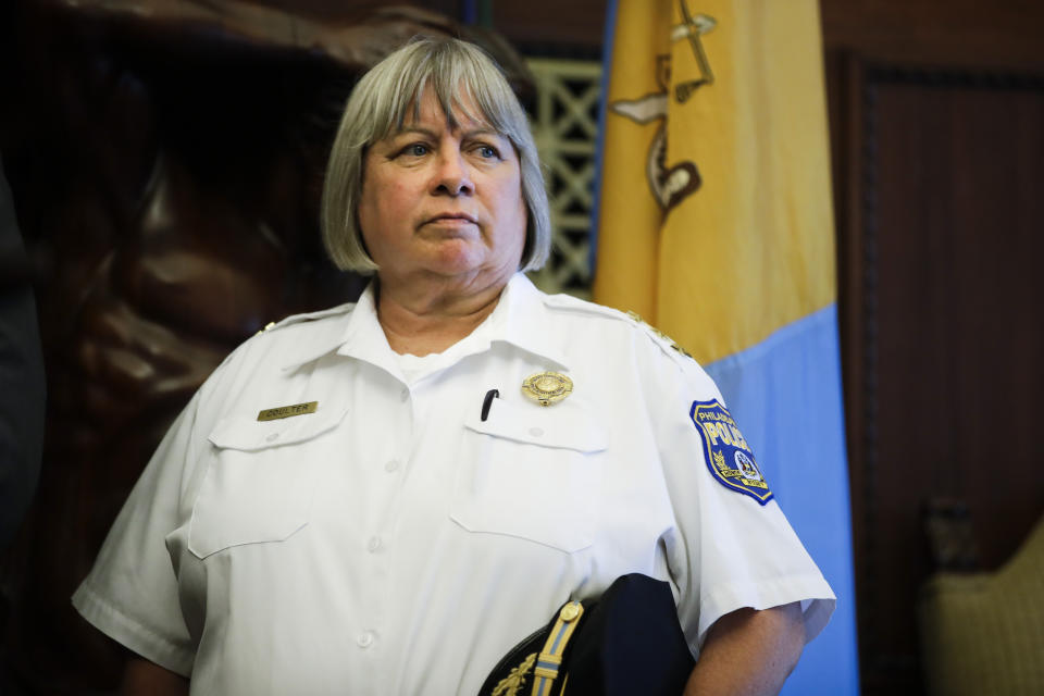 Philadelphia's acting Police Commissioner Christine Coulter listens as Mayor Jim Kenney speaks with members of the media during a news conference at City Hall in Philadelphia, Wednesday, Aug. 21, 2019. She will be filling in, after former police commissioner Richard Ross resigned on Tuesday, Aug. 20, 2019. (AP Photo/Matt Rourke)