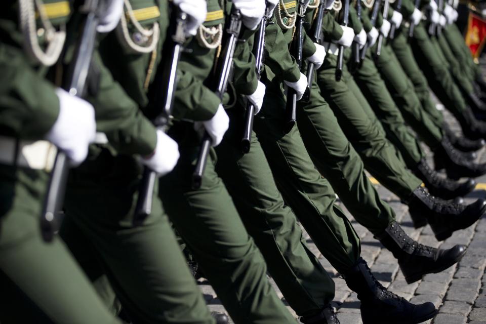 Russian troops march during the Victory Day Parade in Red Square in Moscow, Russia, Friday, May 9, 2014. Thousands of Russian troops marched on Red Square in the annual Victory Day parade in a proud display of the nation's military might amid escalating tensions over Ukraine. (AP Photo/Pavel Golovkin)