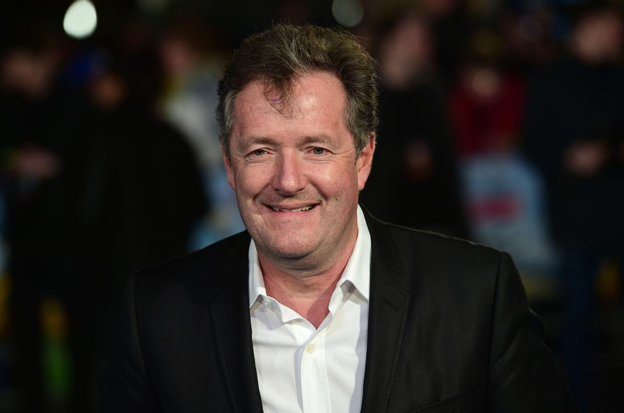 British journalist and television personality Piers Morgan poses for a photograph as he arrives for the European premiere of Eddie The Eagle in London on March 17, 2016. / AFP / LEON NEAL        (Photo credit should read LEON NEAL/AFP/Getty Images)