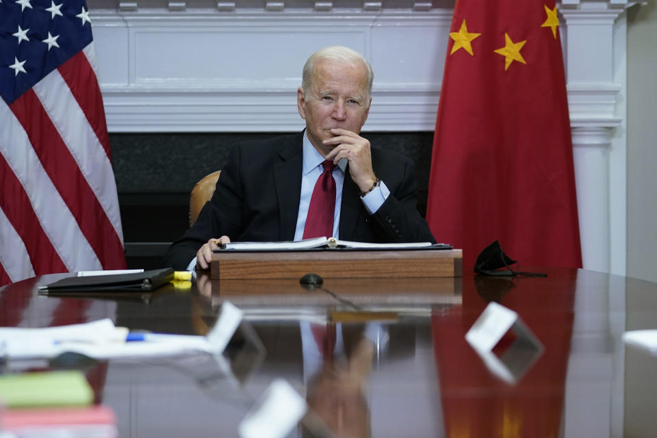 FILE - President Joe Biden listens as he meets virtually with Chinese President Xi Jinping from the Roosevelt Room of the White House in Washington, Monday, Nov. 15, 2021. Just 40% of U.S. adults approve of how President Joe Biden is handling relations with China, a new poll shows, with a majority anxious about Beijing's influence as the White House finds its agenda increasingly shaped by global rivalries. (AP Photo/Susan Walsh, File)