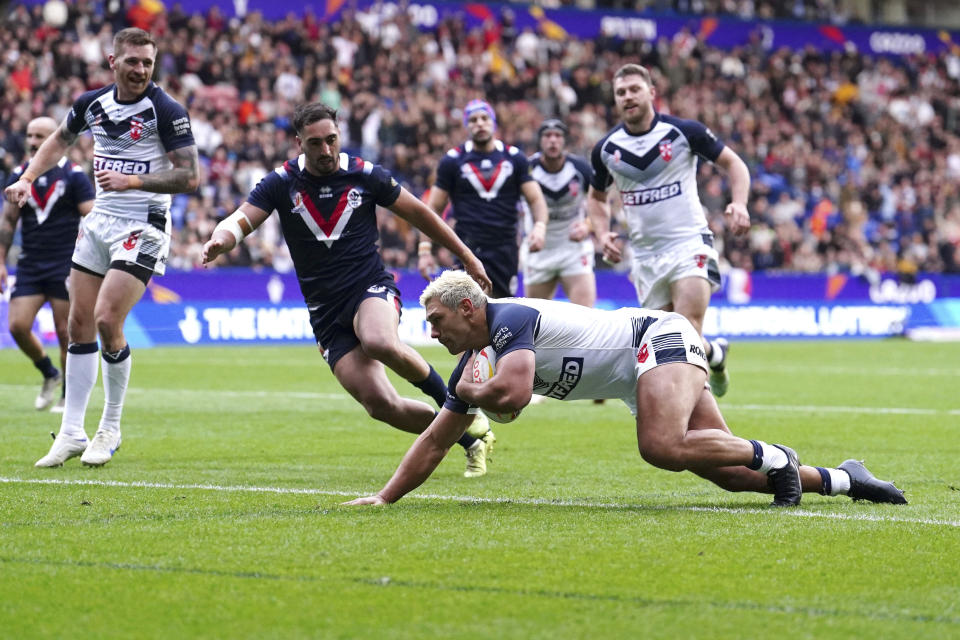 England's Ryan Hall scores a try during the Rugby League World Cup group A match between England and France at the University of Bolton Stadium, Bolton, England, Saturday Oct. 22, 2022. (Richard Sellers/PA via AP)